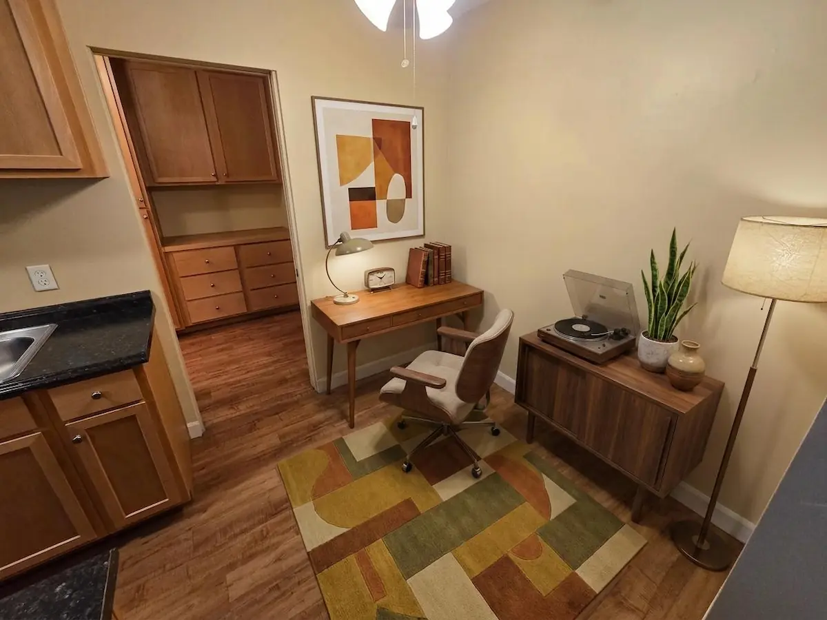 Studio apartment dining area set up as a home office&mdash;virtually staged