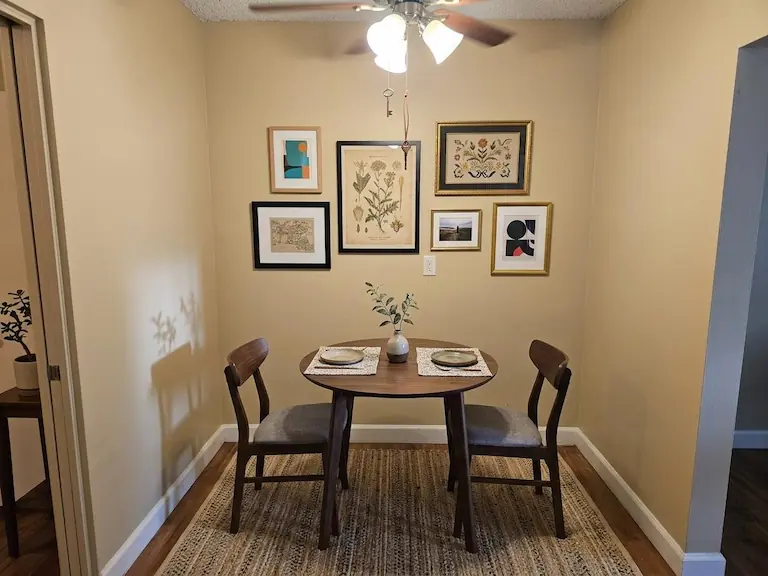 Studio dining area with table for two (virtually staged) (similar unit)