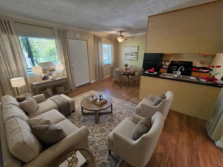 Living, dining, and kitchen furnished (virtually staged)