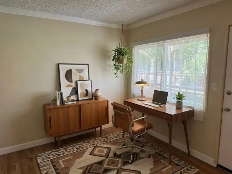 One bedroom living room window area as home office (virtually staged)